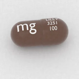 Atomoxetine 100 mg capsule: brown, 20 mm, imprinted LILLY 3251 100 mg.
