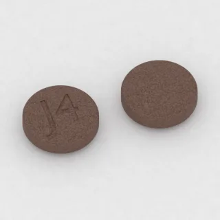 Chlorpromazine 100 mg tablet: brown, round, 10 mm, imprinted J4.