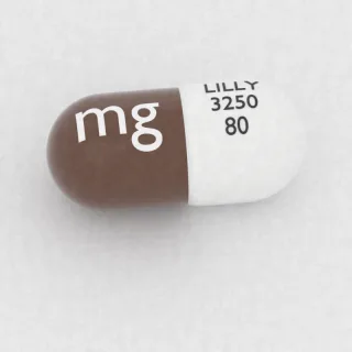 Atomoxetine 80 mg capsule: white and brown, 18 mm, imprinted LILLY 3250 80 mg.