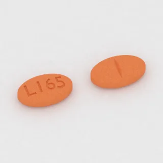 Clonidine 0.3 mg tablet: orange, oval, 7 mm, scored, imprinted L165.