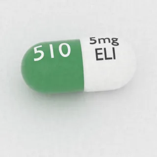 Amphetamine and dextroamphetamine 1.25 mg / 1.25 mg / 1.25 mg / 1.25 mg capsule: white and green, 16 mm, imprinted 5mg ELI 510.