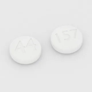 Aspirin 325 mg tablet: white, round, 10 mm, imprinted 44 on one side and 157 on the other.