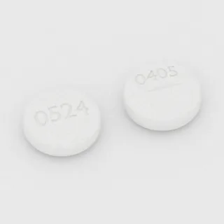 Allopurinol 100 mg tablet: white, round, 10 mm, scored, imprinted 0524 on one side and 0405 on the other.