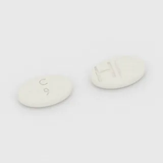 Tablet Klobazam 10 mg: putih, oval, 9 mm, bergaris bagi, dengan kode cetak C 9 H.