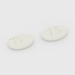 Benztropine 1 mg tablet: white, oval, 11 mm, scored, imprinted T on one side and 15 on the other.