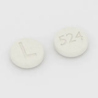 Clonazepam 0.25 mg Tablette: weiß, rund, 6 mm, Prägung L auf der einen Seite und 524 auf der anderen.