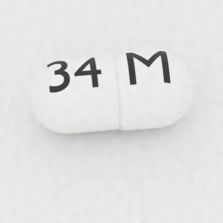 Kapsul Amoksisilin 500 mg: putih, 21 mm, dengan kode cetak M di satu sisi dan 34 di sisi lainnya.