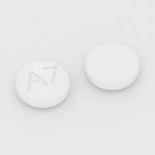 Anastrozole 1 mg en comprimé : blanc, rond, 6 mm, inscription A7.