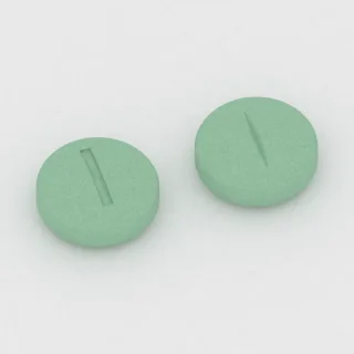 Clonazepam 1 mg Tablette: grün, rund, 8 mm, mit Bruchkerbe, Prägung 1.