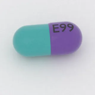 Cefdinir, cápsula de 300 mg: morada y turquesa, 21 mm, con la inscripción E99.