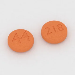 Aspirin 81 mg tablet: orange, round, 8 mm, imprinted 44 on one side and 218 on the other.