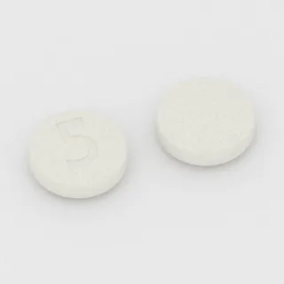 Asenapina 5 mg, tabletka: biała, okrągła, 12 mm, z oznaczeniem 5.