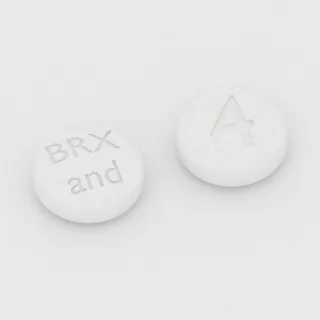 Brekspiprazol 4 mg, tabletka: biała, okrągła, 6 mm, z oznaczeniem BRX and 4.