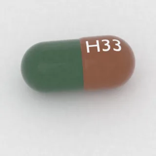Carvedilol 40 mg capsule: orange and green, 18 mm, imprinted H33.