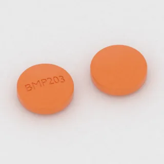 Tablet Amoksisilin 200 mg: oranye, bulat, 11 mm, dengan kode cetak BMP203.