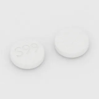 Parasetamol 325 mg tablet: beyaz, yuvarlak, 10 mm, üzerinde S99 baskısı var.