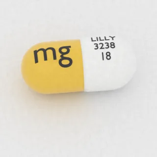 Atomoxetin 18 mg Kapsel: weiß und gelb, 16 mm, Prägung LILLY 3238 18 mg.