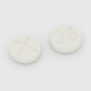 Cetirizin 10 mg Tablette: weiß, rund, 8 mm, Prägung X auf der einen Seite und 36 auf der anderen.