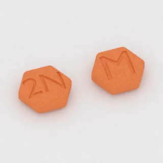 Buprenorphin und Naloxon 2 mg / 0.5 mg Tablette: orange, sechseckig, 6 mm, Prägung 2N auf der einen Seite und M auf der anderen.