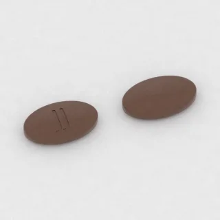 Karbidopa + lewodopa 25 mg / 100 mg / 200 mg, tabletka: brązowa, owalna, 16 mm, z oznaczeniem JJ.