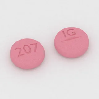 Citalopram 20 mg Tablette: rosa, rund, 7 mm, mit Bruchkerbe, Prägung 207 auf der einen Seite und IG auf der anderen.