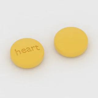 Aspirin 81 mg tablet: yellow, round, 7 mm, imprinted heart.