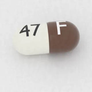 Atomoxetine 80 mg capsule: brown and white, 21 mm, imprinted F on one side and 47 on the other.