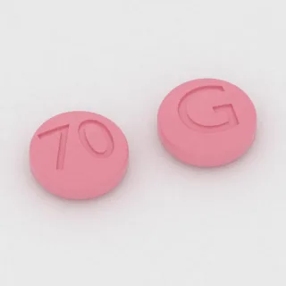 Atowakwon + proguanil 62.5 mg / 25 mg, tabletka: różowa, okrągła, 6 mm, z oznaczeniem 70 po jednej stronie i G po drugiej.