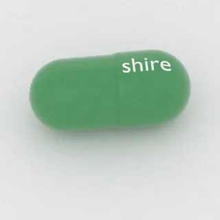 Karbamazepina 100 mg, kapsułka: zielona, 16 mm, z oznaczeniem shire.