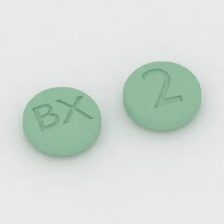 Brekspiprazol 2 mg, tabletka: zielona, okrągła, 6 mm, z oznaczeniem BX po jednej stronie i 2 po drugiej.