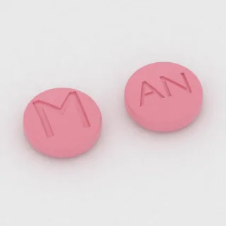 Ambrisentan 5 mg Tablette: rosa, rund, 6 mm, Prägung M auf der einen Seite und AN auf der anderen.
