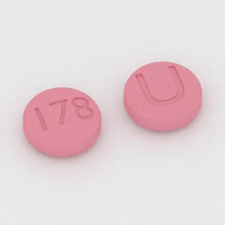 Aripiprazole 15 mg tablet: pink, round, 7 mm, imprinted 178 on one side and U on the other.