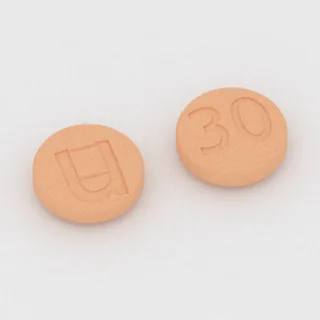 Amphetamine and dextroamphetamine 5 mg / 5 mg / 5 mg / 5 mg tablet: orange, round, 9 mm, imprinted u on one side and 30 on the other.