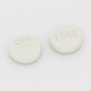 Clomiphene 50 mg tablet: white, round, 9 mm, scored, imprinted OPP on one side and 1068 on the other.