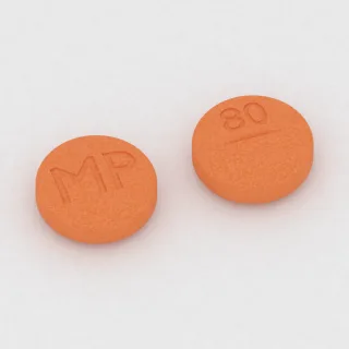 Allopurinol 300 mg tablet: orange, round, 12 mm, scored, imprinted MP on one side and 80 on the other.