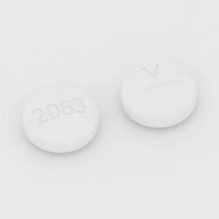 Allopurinol 100 mg tablet: white, round, 10 mm, scored, imprinted 2083 on one side and V on the other.