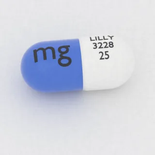 एटोमोक्सेटिन 25 mg कैप्सूल: सफ़ेद और नीला, 16 mm, इम्प्रिंट LILLY 3228 25 mg।