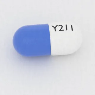एसाइक्लोविर 200 mg कैप्सूल: सफ़ेद और नीला, 19 mm, इम्प्रिंट Y211।