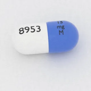 Amphetamine and dextroamphetamine 3.75 mg / 3.75 mg / 3.75 mg / 3.75 mg capsule: blue and white, 18 mm, imprinted 15 mg M 8953.