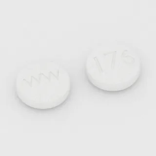 Karyzoprodol 350 mg, tabletka: biała, okrągła, 12 mm, z oznaczeniem WW po jednej stronie i 176 po drugiej.
