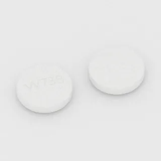 Alfuzosin 10 mg tablet: white and yellow, round, 20 mm, imprinted W738.