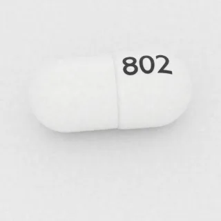 كبسولة سيفالكسين 500 mg: أبيض، 18 مم، النقش 802.