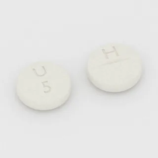 Allopurinol 100 mg tablet: white, round, 8 mm, scored, imprinted U 5 H.