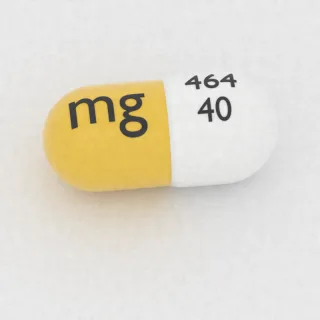 एप्रेपिटेंट 40 mg कैप्सूल: सफ़ेद और पीला, 14 mm, इम्प्रिंट 464 40 mg।