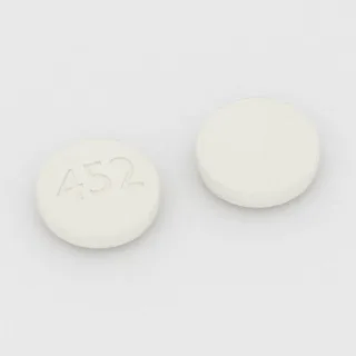 Albendazole 200 mg tablet: white, round, 12 mm, imprinted 452.