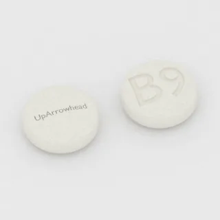Buprenorphine 2 mg tablet: white, round, 6 mm, imprinted UpArrowhead on one side and B9 on the other.