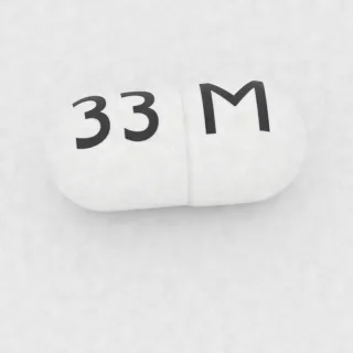 Kapsul Amoksisilin 250 mg: putih, 18 mm, dengan kode cetak M di satu sisi dan 33 di sisi lainnya.