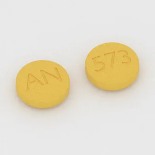 Betanecol 25 mg em comprimido: amarelo, redondo, 11 mm, com a gravação AN de um lado e 573 do outro.