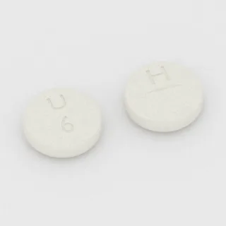 Allopurinol 300 mg tablet: white, round, 11 mm, scored, imprinted U 6 H.