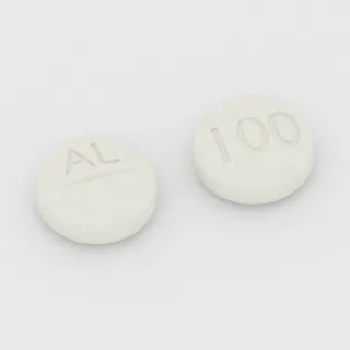 Allopurinol 100 mg tablet: white, round, 8 mm, scored, imprinted AL on one side and 100 on the other.